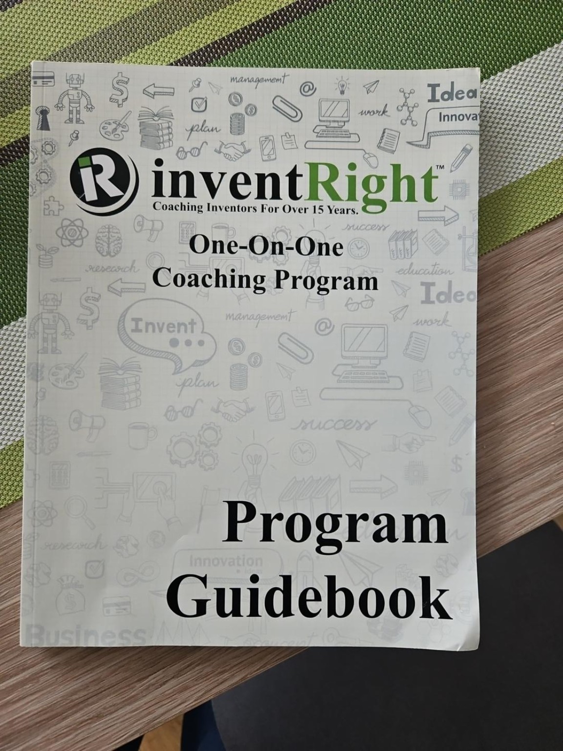 InventRight One-on-One Coaching Program guidebook used during independent invention work